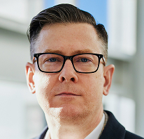 Alexander Hughes, dirigente CEO di un'azienda di crypto trading, ritratto